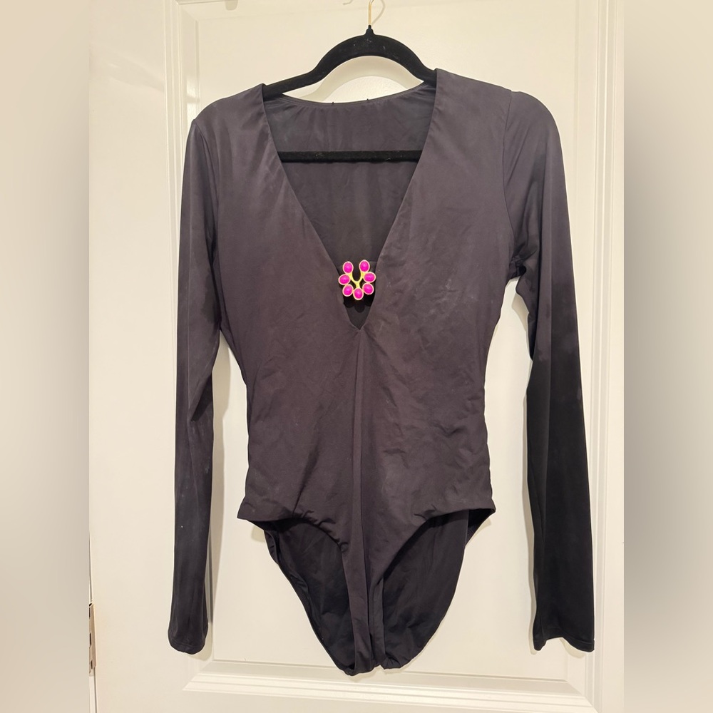 Trina Turk Black Long-Sleeve V-Neck swimsuit with Pink Accent